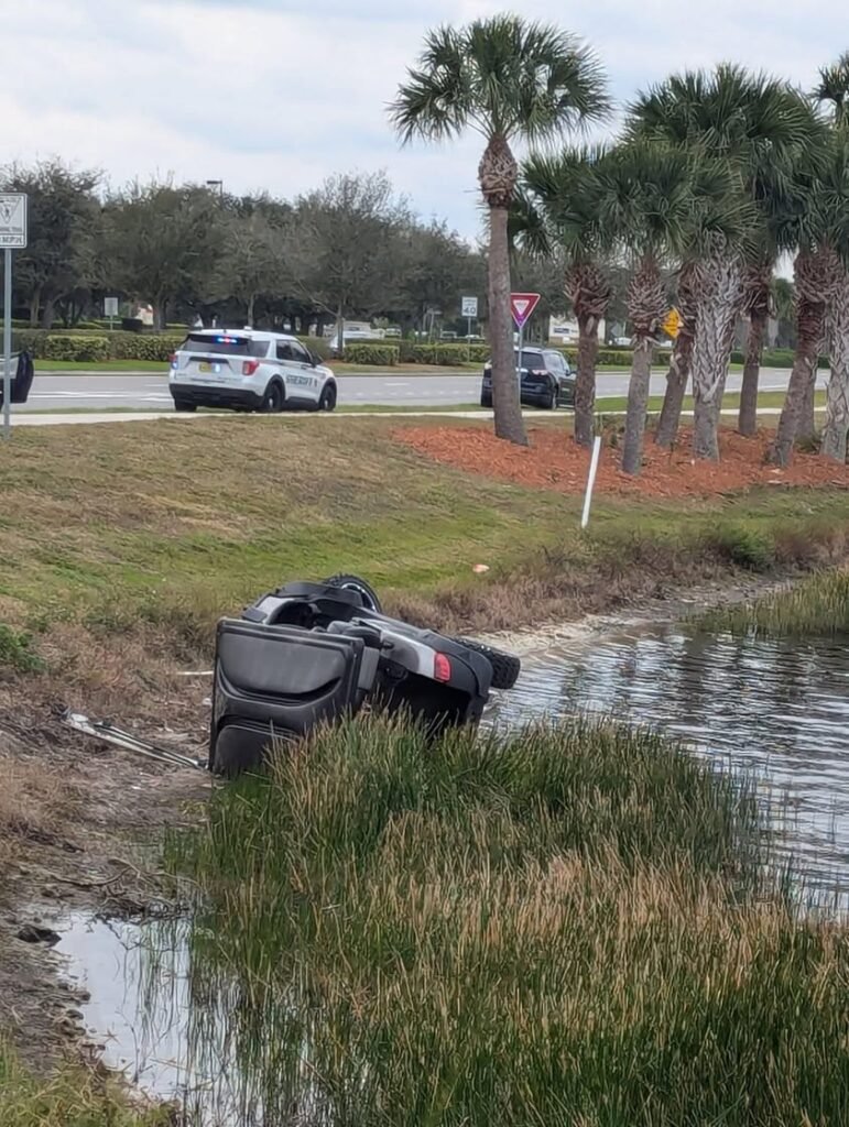 Car vs Golf Cart in Viera circle of death.  📸 Laurence Curly