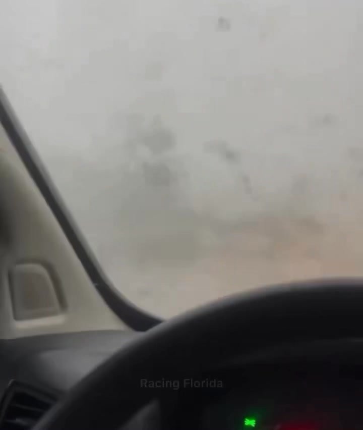 👀🌪️Woman very calmly records from inside her vehicle as an EF-2 tornado passes directly over her in Longwood, FL.