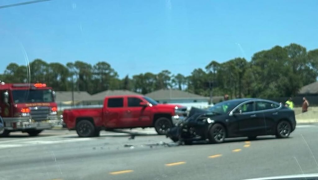 Tesla vs Truck Minton and Jupiter. Minton Rd is blocked.
