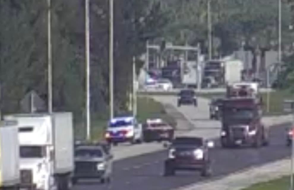 Police "pitted" a fleeing Tesla then the suspect fled on foot into the woods near Malabar and 95. Suspect is now in cust...