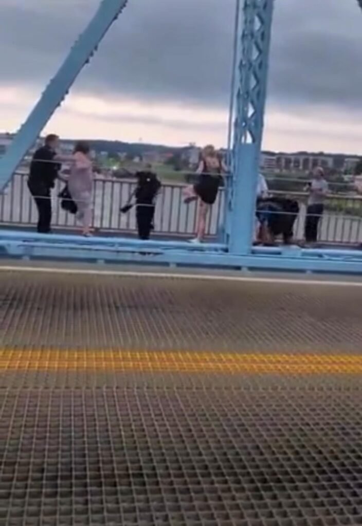 Police enforce compliance with anti-ICE protestors on Roebling Bridge (a bridge between Ohio and Kentucky) where 13-16 w...