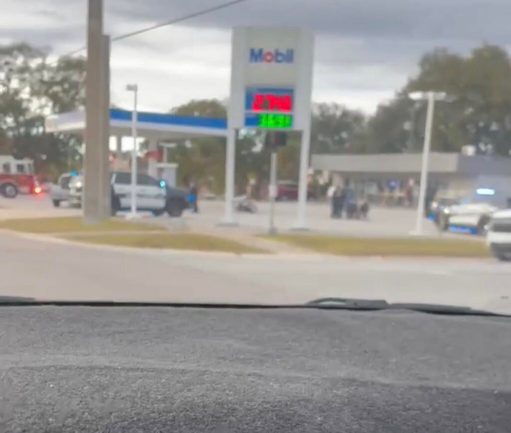 Motorcyclist down and being administered aid by law enforcement in Titusville.