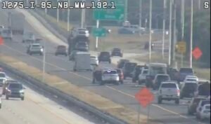 Accident 95 South at Wickham Rd exit blocking outside lane.